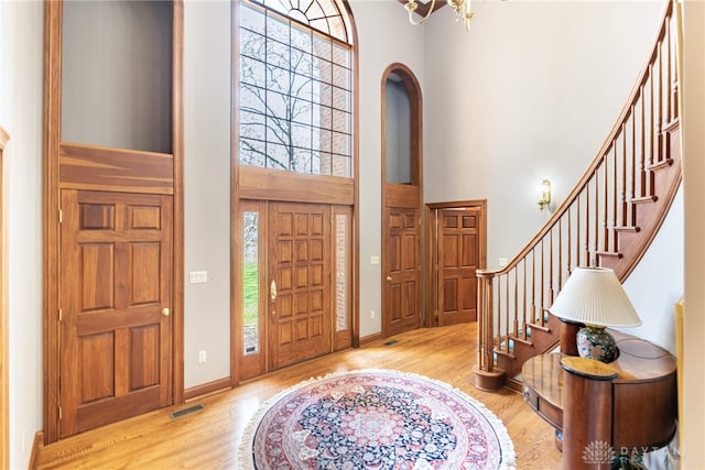 514 Shambord Cir, Kettering, OH 45429 - foyer entrance featuring a towering ceiling, wood finished floors, stairs, and plenty of natural light