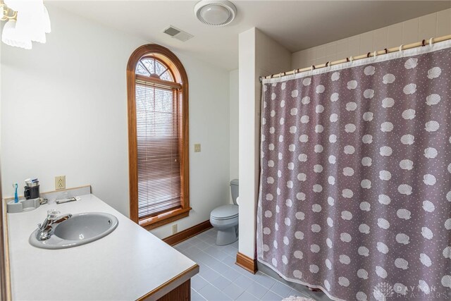 514 Shambord Cir, Kettering, OH 45429 - bathroom with toilet, vanity, tile patterned floors, and a shower with shower curtain