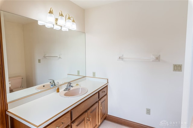 514 Shambord Cir, Kettering, OH 45429 - bathroom featuring vanity, toilet, baseboards, and tile patterned flooring