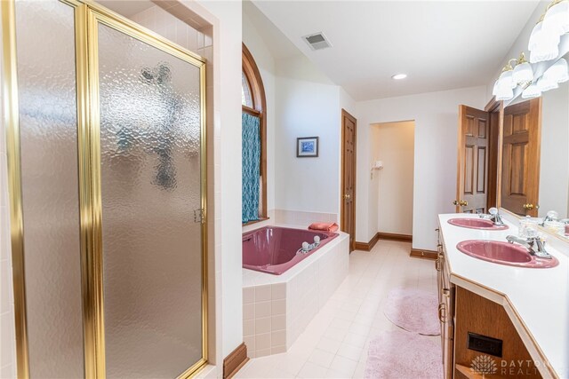 514 Shambord Cir, Kettering, OH 45429 - full bathroom with double vanity, a bath, a stall shower, tile patterned floors, and baseboards