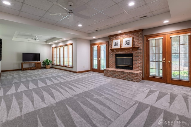 514 Shambord Cir, Kettering, OH 45429 - unfurnished living room featuring french doors, baseboards, a ceiling fan, carpet, and a tray ceiling
