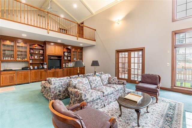 514 Shambord Cir, Kettering, OH 45429 - carpeted living room with high vaulted ceiling, french doors, healthy amount of natural light, and a ceiling fan