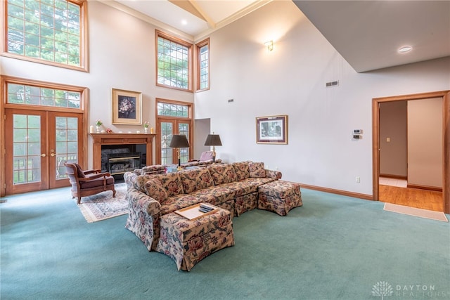 514 Shambord Cir, Kettering, OH 45429 - living area with carpet floors, high vaulted ceiling, a high end fireplace, baseboards, and french doors