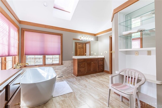 514 Shambord Cir, Kettering, OH 45429 - full bath featuring a freestanding tub, a skylight, vanity, and vaulted ceiling