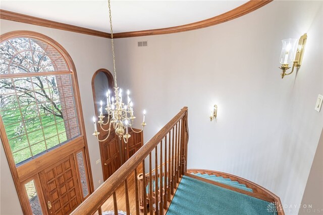 514 Shambord Cir, Kettering, OH 45429 - stairway with a chandelier, crown molding, and a towering ceiling
