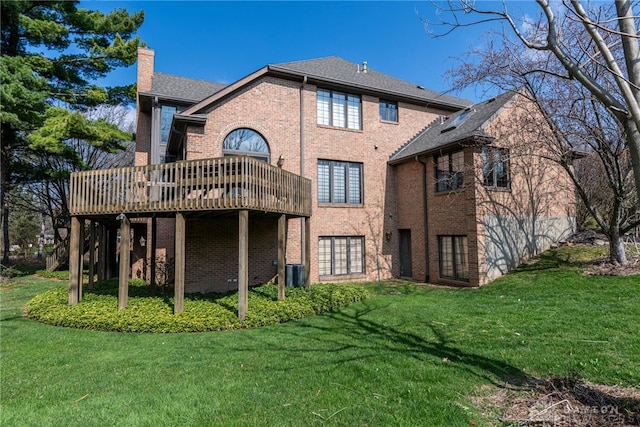 514 Shambord Cir, Kettering, OH 45429 - back of property featuring french doors, a lawn, a deck, and brick siding