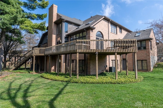514 Shambord Cir, Kettering, OH 45429 - back of house featuring a deck, a chimney, brick siding, and a yard