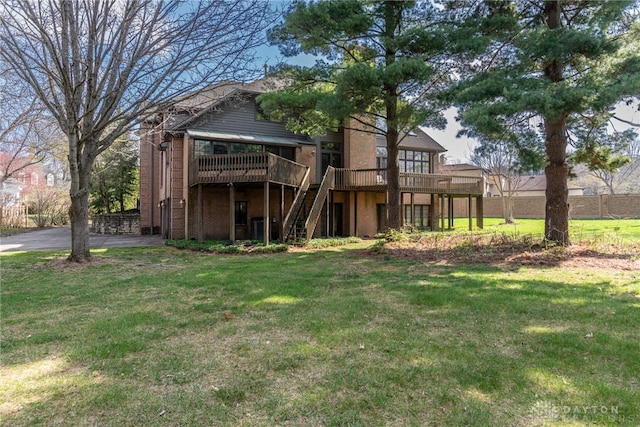 514 Shambord Cir, Kettering, OH 45429 - rear view of house featuring stairway, a deck, and a lawn