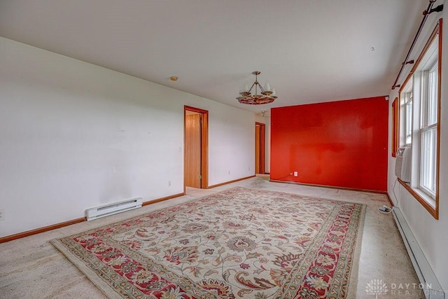 6423 Howe Rd, Middletown, OH 45042 - spare room with a baseboard radiator, baseboards, and a chandelier
