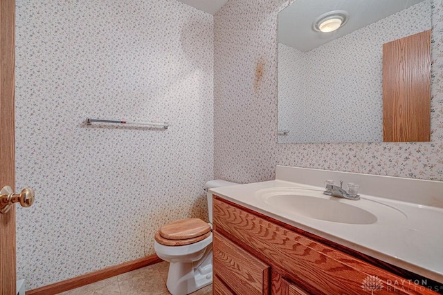 6423 Howe Rd, Middletown, OH 45042 - half bathroom featuring toilet, vanity, tile patterned flooring, and wallpapered walls