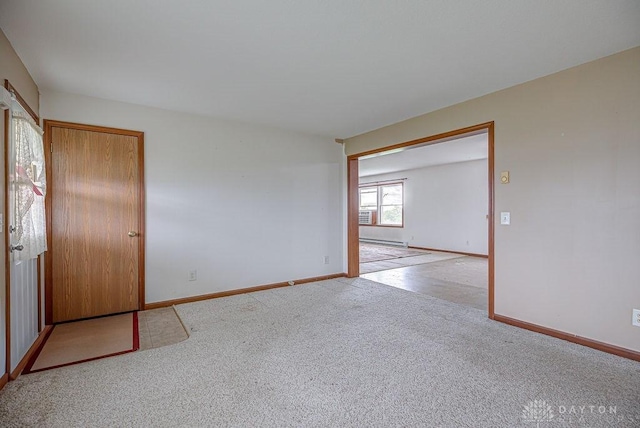 6423 Howe Rd, Middletown, OH 45042 - carpeted spare room featuring baseboards and a baseboard radiator
