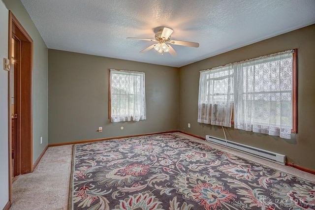 6423 Howe Rd, Middletown, OH 45042 - empty room featuring a baseboard heating unit, carpet floors, a ceiling fan, a textured ceiling, and baseboards