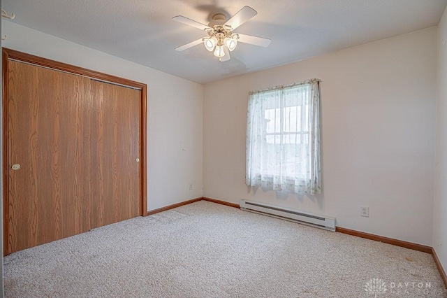 6423 Howe Rd, Middletown, OH 45042 - unfurnished bedroom featuring a baseboard radiator, carpet, baseboards, and a closet