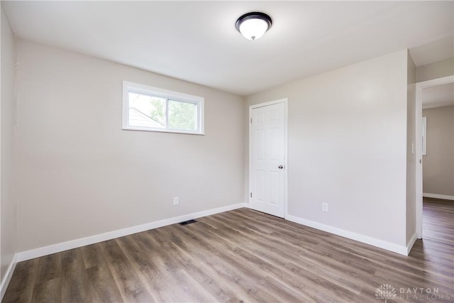 1533 Weaver St, Dayton, OH 45417 - unfurnished room featuring wood finished floors and baseboards