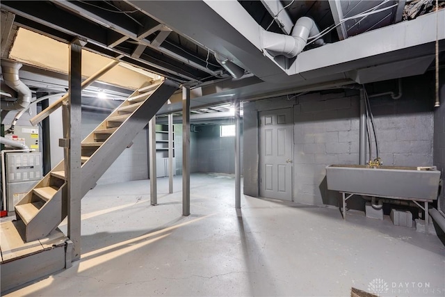 1533 Weaver St, Dayton, OH 45417 - below grade area with a sink, stairs, and heating unit