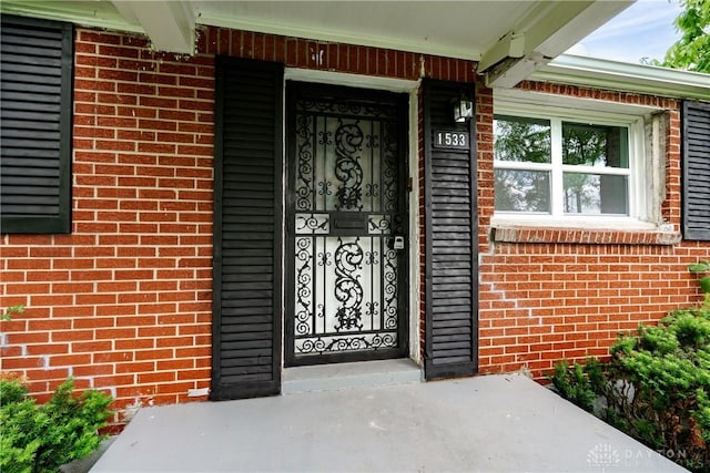 1533 Weaver St, Dayton, OH 45417 - property entrance with brick siding and covered porch