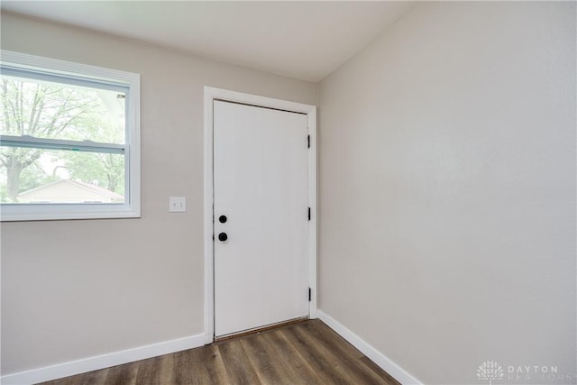 1533 Weaver St, Dayton, OH 45417 - doorway to outside featuring dark wood-style flooring and baseboards