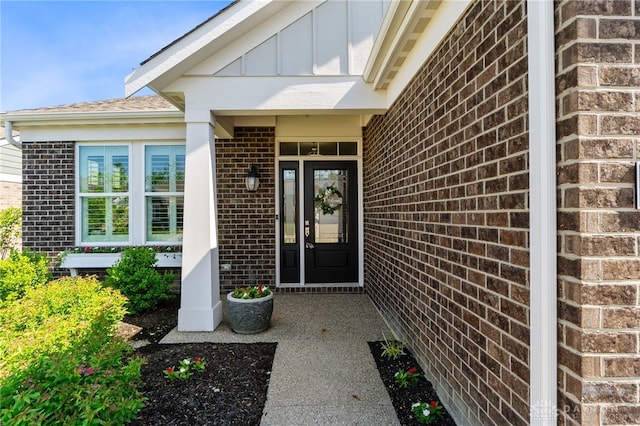 4978 Renaissance Park Dr, Middletown, OH 45005 - doorway to property featuring brick siding and board and batten siding