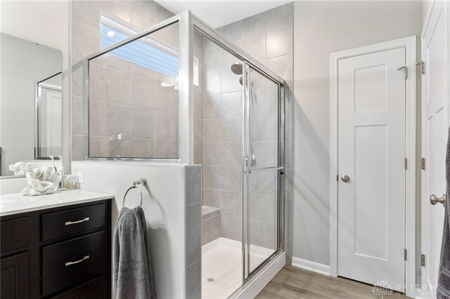 4978 Renaissance Park Dr, Middletown, OH 45005 - bathroom featuring a shower stall, vanity, and wood finished floors