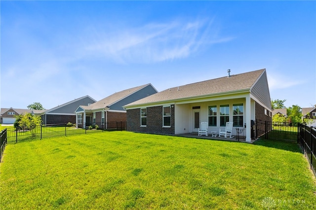 4978 Renaissance Park Dr, Middletown, OH 45005 - rear view of property with a patio area and brick siding