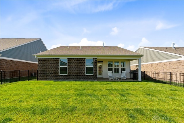4978 Renaissance Park Dr, Middletown, OH 45005 - rear view of property featuring a patio area, brick siding, and a shingled roof