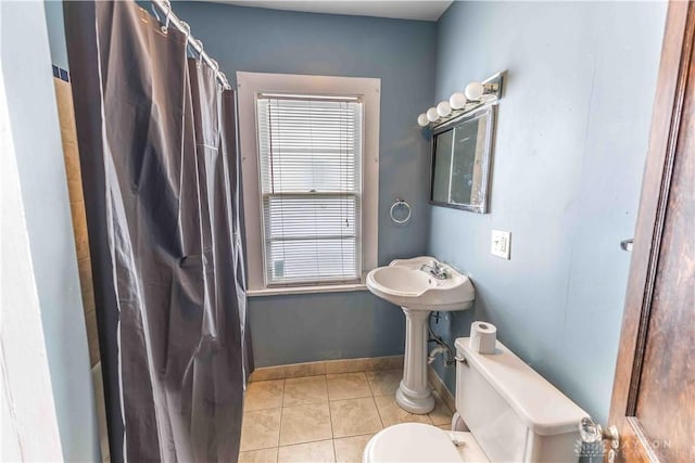 2312 Saint Charles Ave, Dayton, OH 45410 - full bath with tile patterned flooring, toilet, a shower with shower curtain, and baseboards