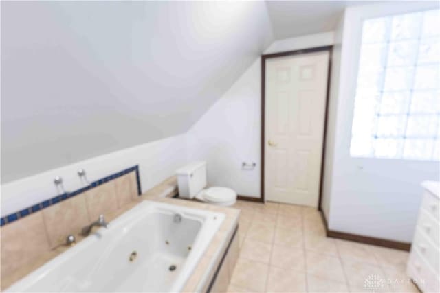 2312 Saint Charles Ave, Dayton, OH 45410 - full bath featuring a whirlpool tub, lofted ceiling, and tile patterned flooring