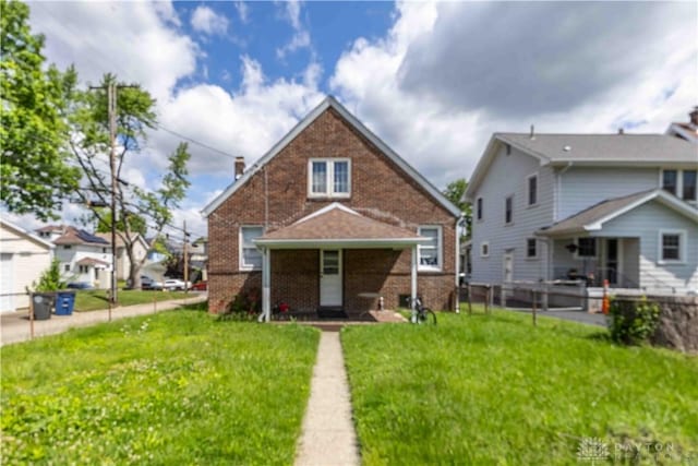 2312 Saint Charles Ave, Dayton, OH 45410 - back of property featuring brick siding and a lawn