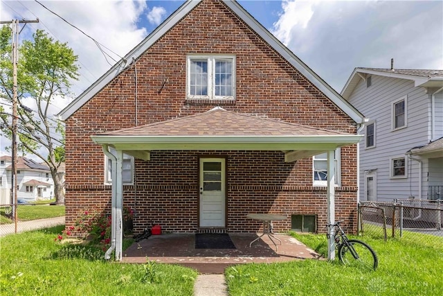 2312 Saint Charles Ave, Dayton, OH 45410 - rear view of house with brick siding, a patio area, and a shingled roof