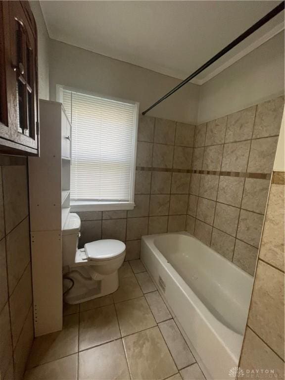 508 W Hillcrest Ave, Dayton, OH 45406 - full bathroom featuring toilet, tile walls, tile patterned floors, and tub / shower combination