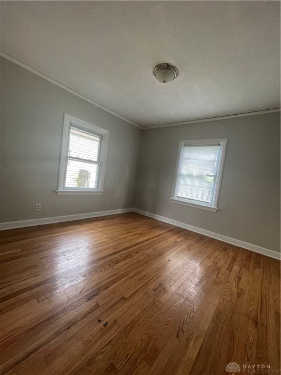 508 W Hillcrest Ave, Dayton, OH 45406 - spare room with crown molding, baseboards, and wood finished floors