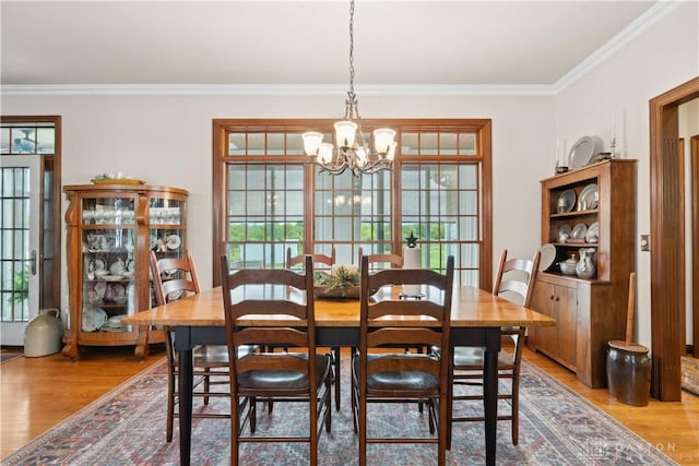1134 N Webb Rd, Adams Twp, OH 45177 - dining space with crown molding, light wood-type flooring, and a chandelier