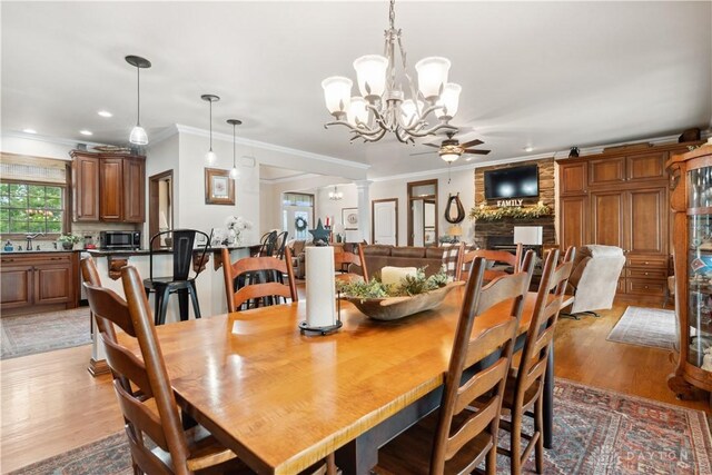 1134 N Webb Rd, Adams Twp, OH 45177 - dining room featuring crown molding, a chandelier, ceiling fan, light wood-style flooring, and recessed lighting