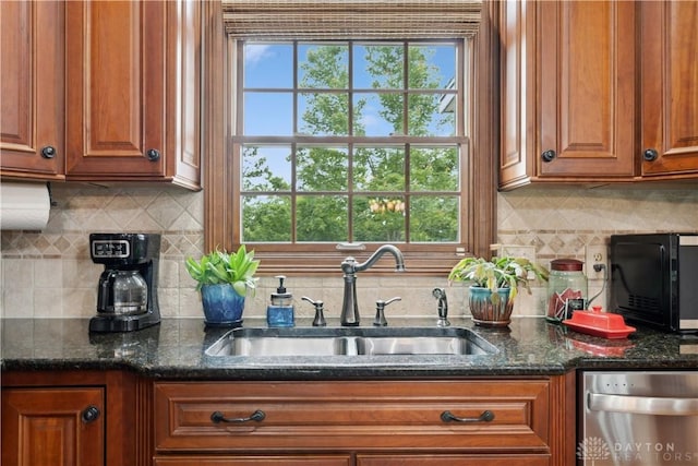 1134 N Webb Rd, Adams Twp, OH 45177 - kitchen featuring a sink, stainless steel dishwasher, brown cabinets, black microwave, and backsplash