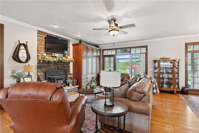 1134 N Webb Rd, Adams Twp, OH 45177 - living area with plenty of natural light, ornamental molding, ceiling fan, and light wood-style flooring