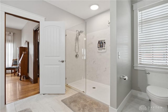 1134 N Webb Rd, Adams Twp, OH 45177 - full bathroom featuring a walk in shower, toilet, healthy amount of natural light, and baseboards