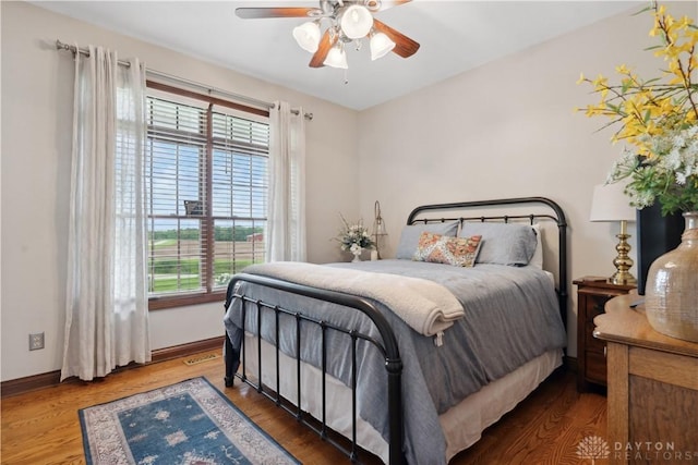 1134 N Webb Rd, Adams Twp, OH 45177 - bedroom with baseboards, wood finished floors, and ceiling fan