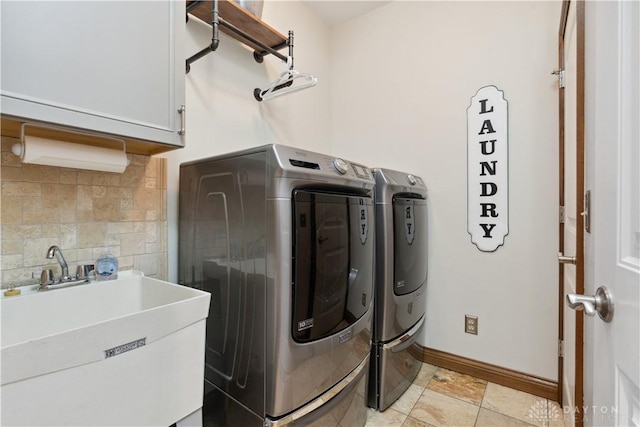 1134 N Webb Rd, Adams Twp, OH 45177 - laundry room featuring cabinet space, washing machine and clothes dryer, and baseboards