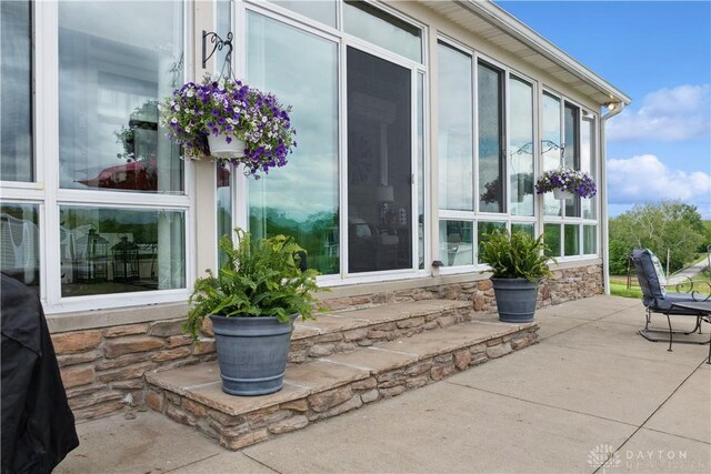 1134 N Webb Rd, Adams Twp, OH 45177 - view of patio with a sunroom