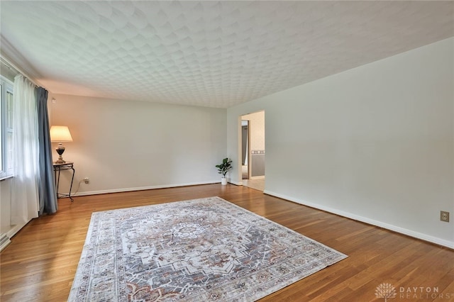 300 Magnolia Ave, Englewood, OH 45322 - spare room featuring baseboards and wood finished floors