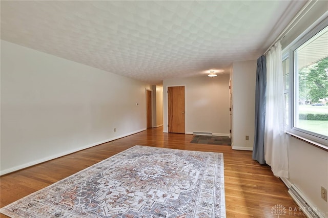 300 Magnolia Ave, Englewood, OH 45322 - spare room featuring a baseboard radiator, a baseboard heating unit, plenty of natural light, and baseboards
