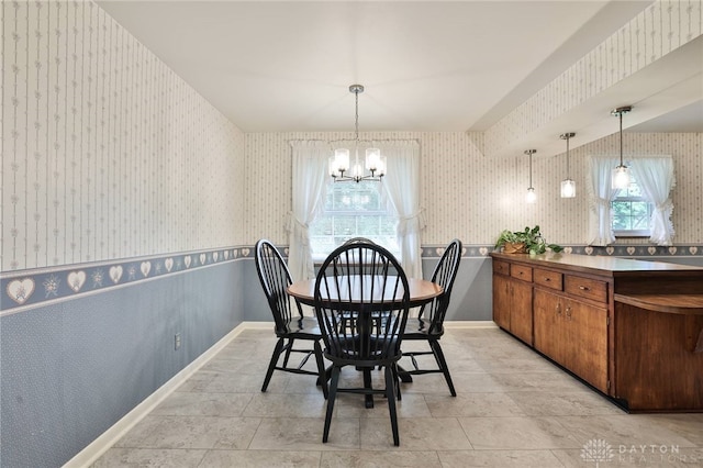 300 Magnolia Ave, Englewood, OH 45322 - dining space featuring wallpapered walls, a chandelier, and baseboards