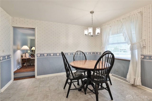 300 Magnolia Ave, Englewood, OH 45322 - dining space with wallpapered walls and a chandelier