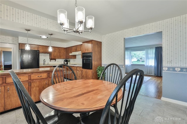 300 Magnolia Ave, Englewood, OH 45322 - dining room featuring wallpapered walls and a chandelier