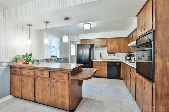 300 Magnolia Ave, Englewood, OH 45322 - kitchen featuring wallpapered walls, black appliances, a sink, a peninsula, and brown cabinets