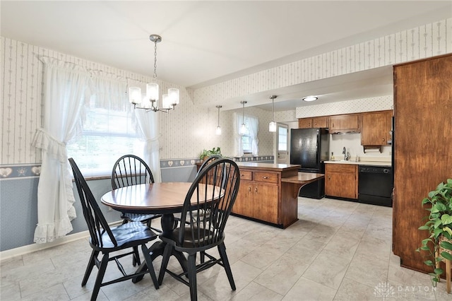 300 Magnolia Ave, Englewood, OH 45322 - dining space with wallpapered walls and a chandelier