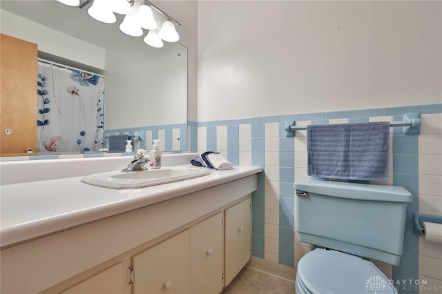 300 Magnolia Ave, Englewood, OH 45322 - full bath with toilet, tile walls, vanity, tile patterned floors, and wainscoting