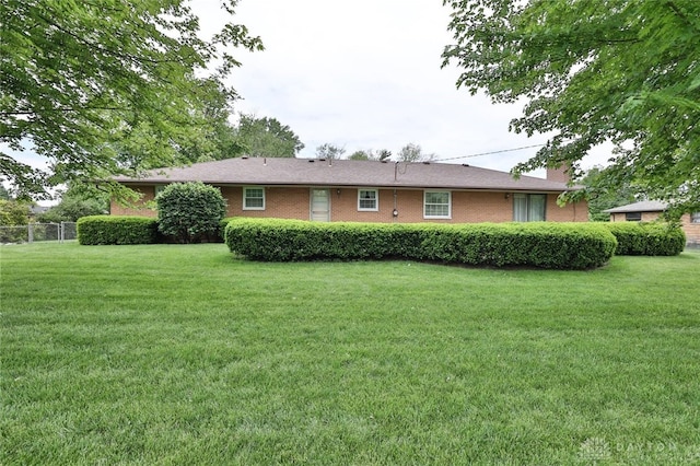300 Magnolia Ave, Englewood, OH 45322 - rear view of property with brick siding and a chimney