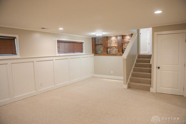 316 Honey Jane Dr, Beavercreek, OH 45434 - finished below grade area with carpet flooring, ornamental molding, stairs, a decorative wall, and recessed lighting