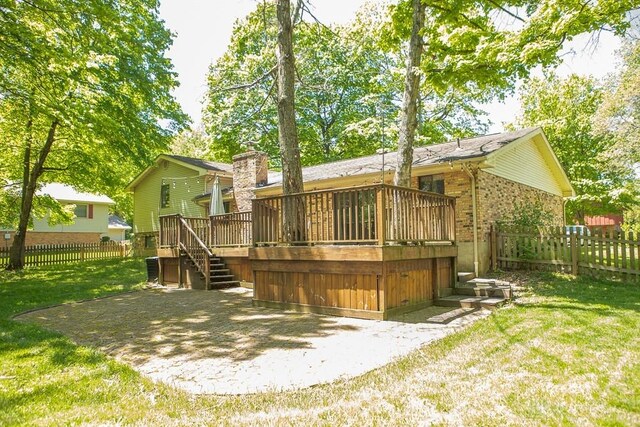 316 Honey Jane Dr, Beavercreek, OH 45434 - back of house with stairway, a deck, a patio area, brick siding, and a chimney